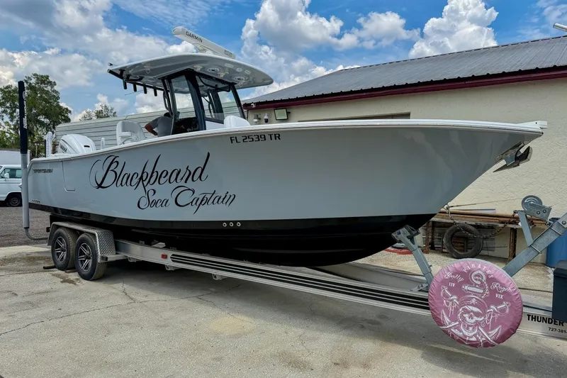 Slide: The Image of 2023 Sportsman Heritage 261 Center Console boat with "Blackbeard Soca Captain" lettering. - 49