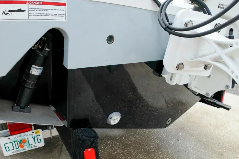 Slide: The Image of 2023 Sportsman Heritage 261 Center Console boat with Yamaha engine, parked outdoors. - 59