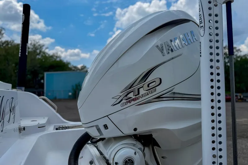 Slide: The Image of 2023 Sportsman Heritage 261 Center Console boat with outboard motor detail. - 61