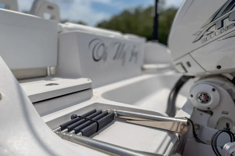 Slide: The Image of 2023 Sportsman Heritage 261 Center Console boat with Power-Pole anchor, "Oh My Joy" text. - 62