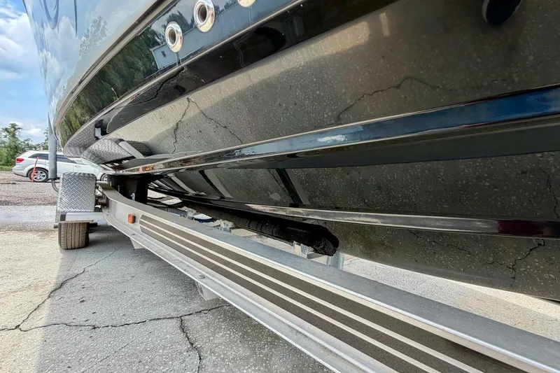 Slide: The Image of 2023 Sportsman Heritage 261 Center Console boat on trailer, parked outdoors. - 72