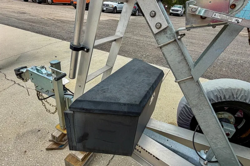 Slide: The Image of Open toolbox on trailer with various tools and accessories, near Sportsman Heritage 261 Center Console. - 82
