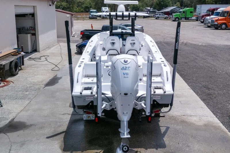 Slide: The Image of 2023 Sportsman Heritage 261 Center Console boat with Yamaha 425 V8 engine, docked outdoors. - 92