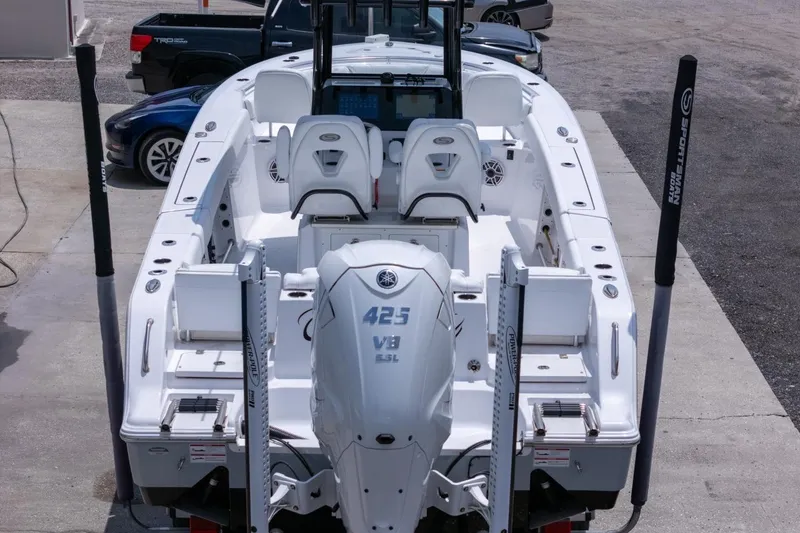 Slide: The Image of 2023 Sportsman Heritage 261 Center Console boat on trailer, featuring Yamaha V8 engine. - 94