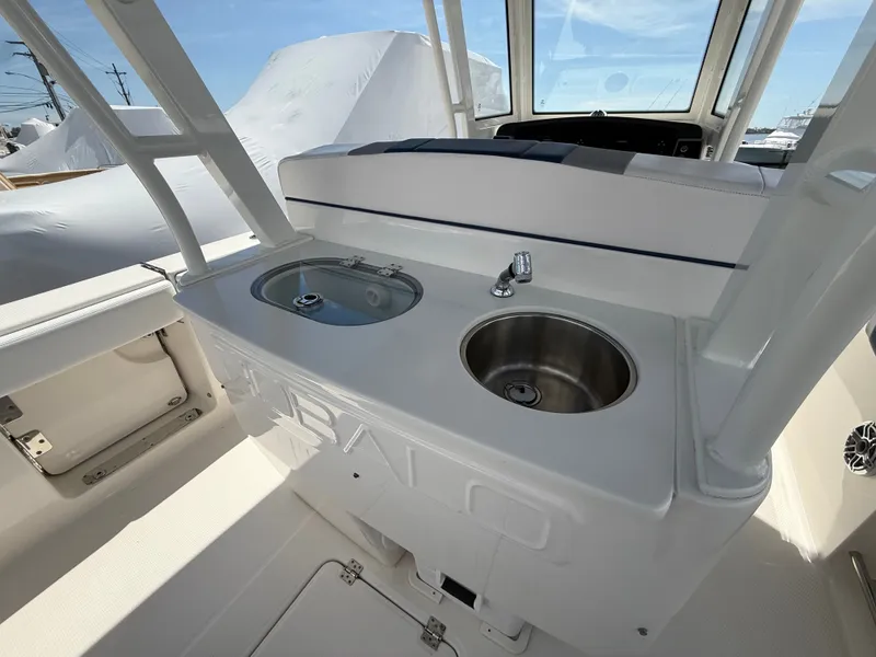 Slide: The Image of Interior of 2021 Robalo R272 Center Console with sink. - 17