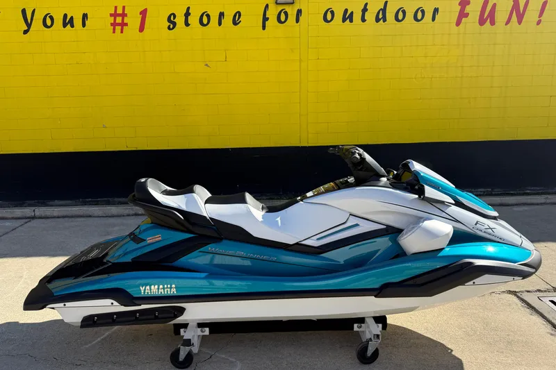 The Image of 2026 Yamaha WaveRunner FX Cruiser HO in front of a yellow wall, showcasing sleek design. - 1