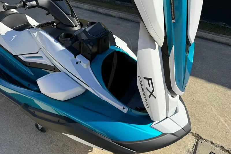 Slide: The Image of 2026 Yamaha WaveRunner FX Cruiser HO with open storage compartment, showcasing sleek design. - 13