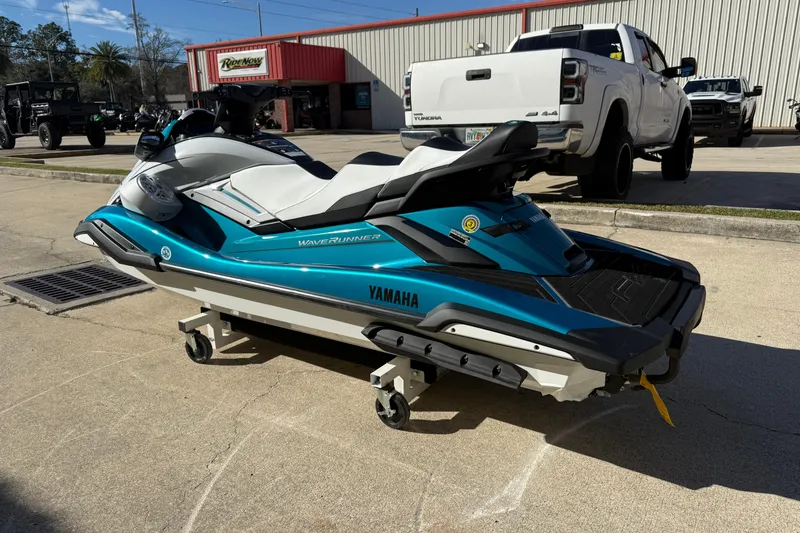 Slide: The Image of 2026 Yamaha WaveRunner FX Cruiser HO in a parking lot, showcasing sleek design. - 8