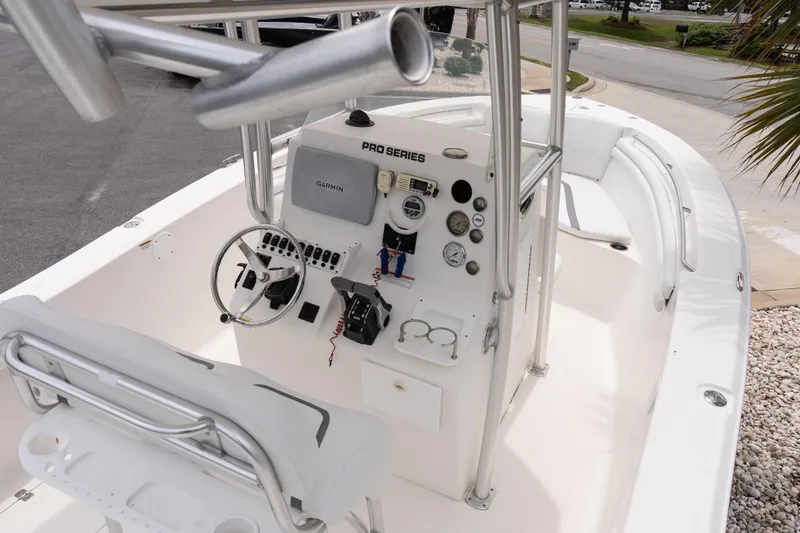 Slide: The Image of 2010 Sea Fox 256 Center Console boat interior with steering wheel and navigation equipment. - 10