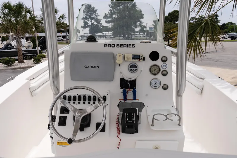 Slide: The Image of 2010 Sea Fox 256 Center Console boat dashboard with Garmin navigation and control instruments. - 11