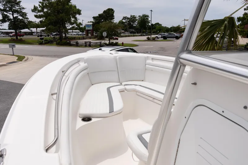 Slide: The Image of 2010 Sea Fox 256 Center Console boat with white seating and stainless steel railings. - 14