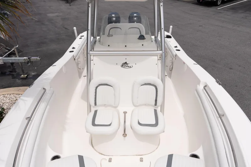 Slide: The Image of 2010 Sea Fox 256 Center Console boat interior with seating and console view. - 16