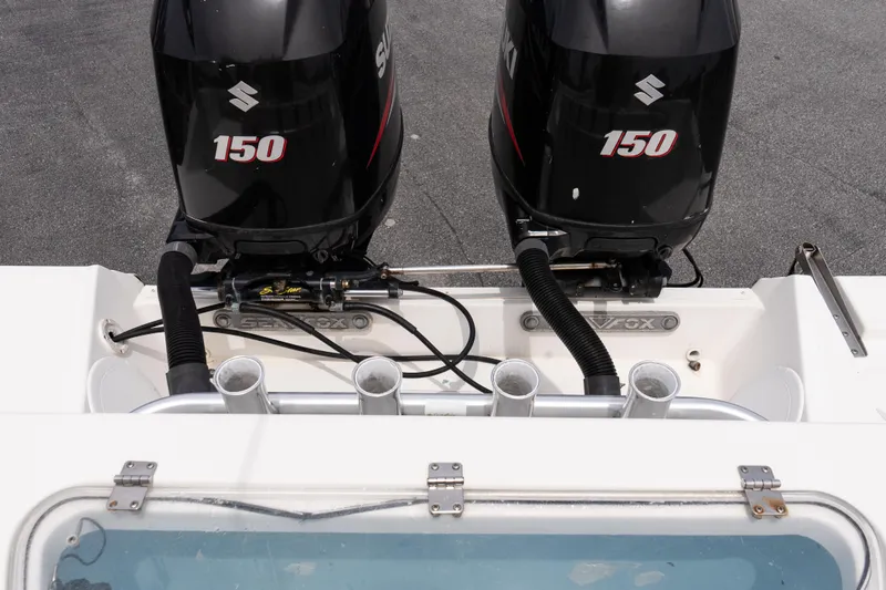 Slide: The Image of Twin Suzuki 150 engines on a 2010 Sea Fox 256 Center Console boat. - 21