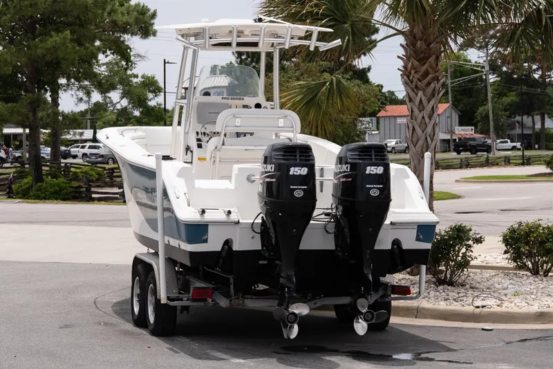 Slide: The Image of 2010 Sea Fox 256 Center Console boat on trailer with dual Suzuki 150 engines. - 3