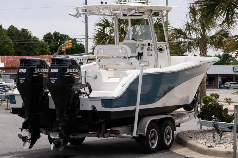 Slide: The Image of 2010 Sea Fox 256 Center Console boat with dual Suzuki 150 engines on a trailer. - 5