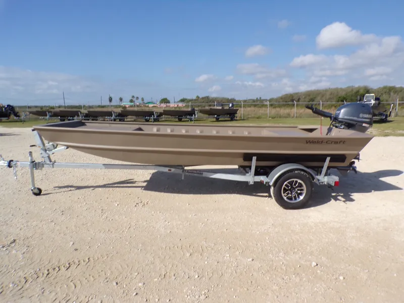 The Image of Weldcraft 1652 CDL FO 2026 boat on trailer, side view. - 1