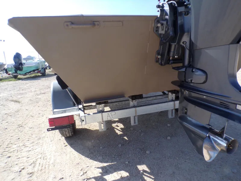 Slide: The Image of Rear view of a 2026 Weldcraft 1652 CDL FO boat on trailer. - 15