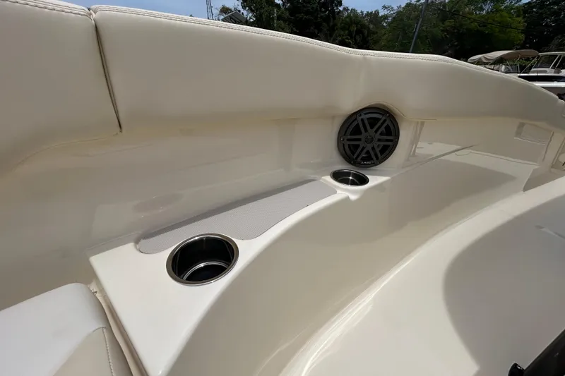 Slide: The Image of 2026 Scout 220 XSF boat interior with cup holders and speaker. - 12
