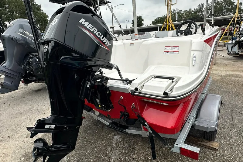 Slide: The Image of 2024 Bayliner Element M15 boat with Mercury outboard motor on trailer. - 17