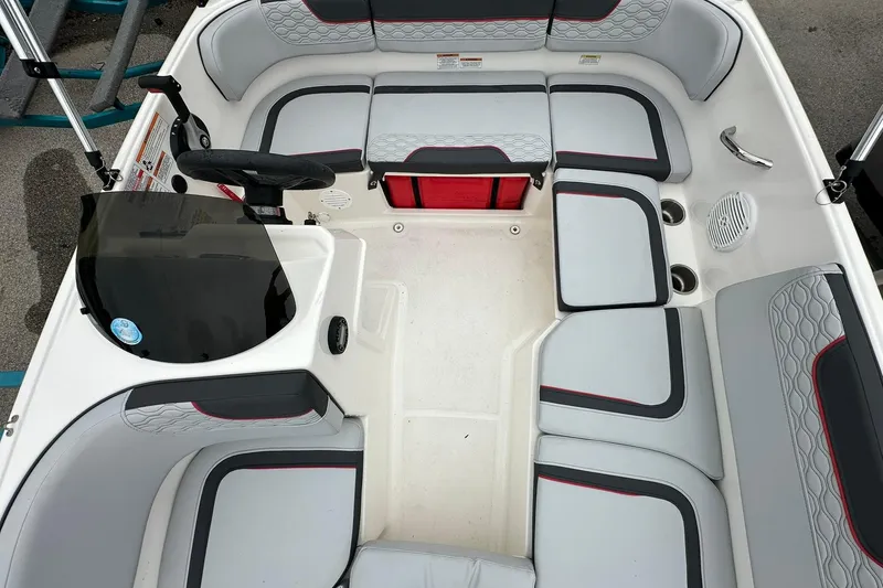 Slide: The Image of 2024 Bayliner Element M15 boat interior with seating and steering console. - 7