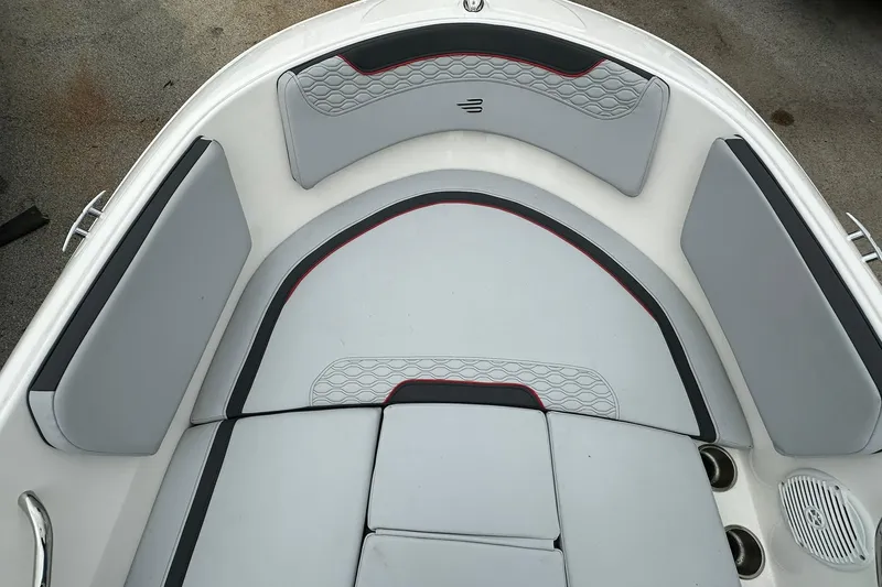 Slide: The Image of 2024 Bayliner Element M15 boat interior with gray cushioned seating and modern design. - 8