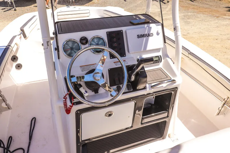 Slide: The Image of 2017 Yamaha Boats 190 FSH Sport dashboard with steering wheel and controls. - 12