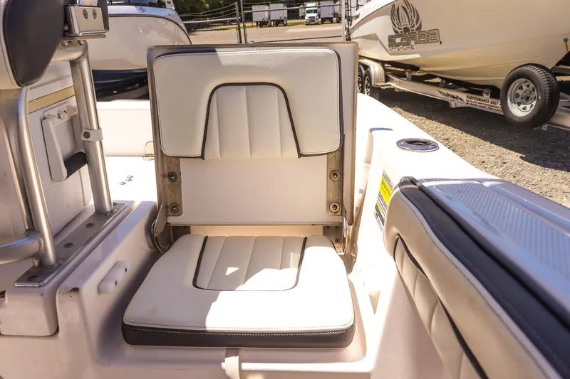 Slide: The Image of 2017 Yamaha Boats 190 FSH Sport interior seating detail in sunlight. - 15
