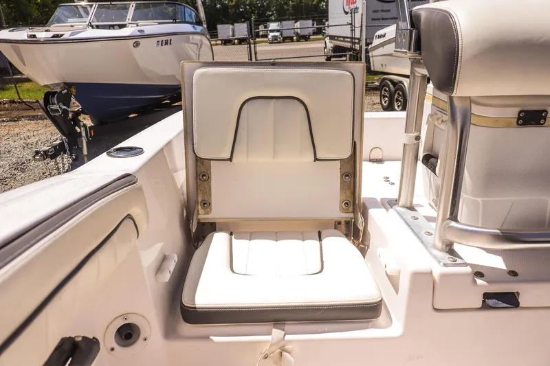 Slide: The Image of 2017 Yamaha Boats 190 FSH Sport interior seating detail with white upholstery. - 16