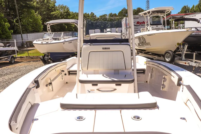 Slide: The Image of 2017 Yamaha Boats 190 FSH Sport interior view at a boat dealership. - 9