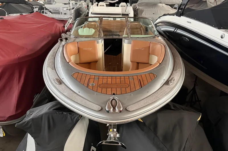 Slide: The Image of 2013 Chris-Craft Launch 25 boat with elegant wood and leather interior, docked in storage. - 3
