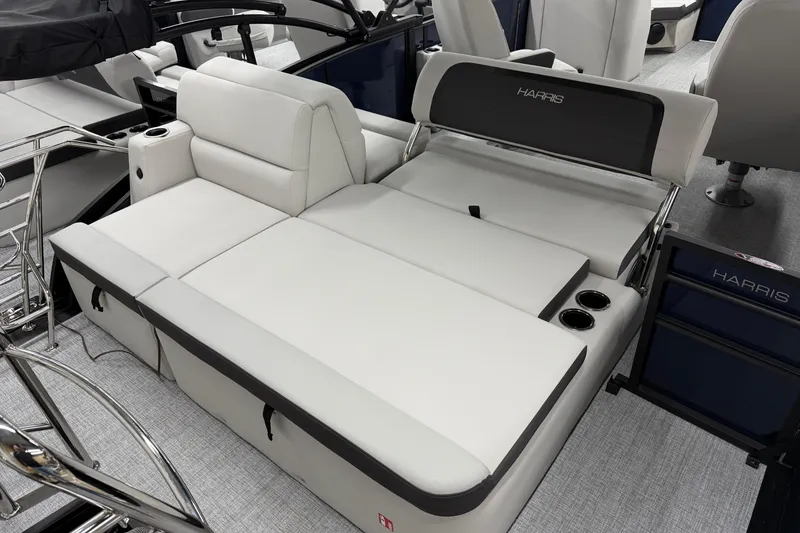 Slide: The Image of 2026 Harris Cruiser 210 SLDH boat interior with luxurious seating and cup holders. - 10
