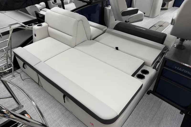 Slide: The Image of 2026 Harris Cruiser 210 SLDH boat interior with luxurious white seating and cup holders. - 11
