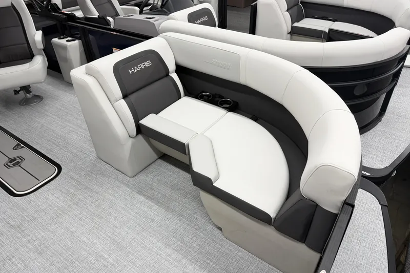 Slide: The Image of 2026 Harris Cruiser 210 SLDH boat interior with luxurious seating and cup holders. - 3