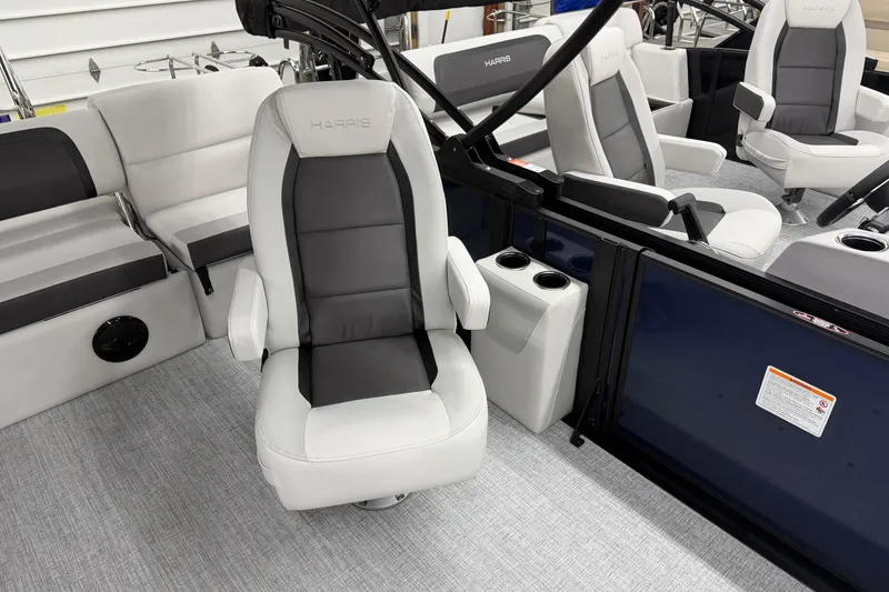 Slide: The Image of 2026 Harris Cruiser 210 SLDH boat interior with plush seating and modern design. - 5