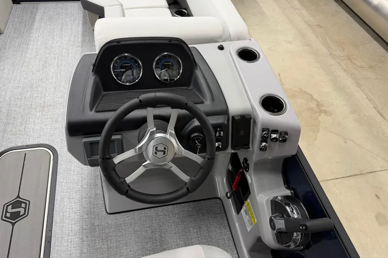 Slide: The Image of 2026 Harris Cruiser 210 SLDH boat dashboard with steering wheel and controls. - 7