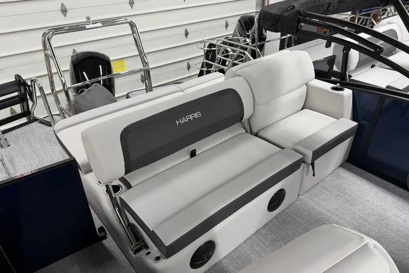Slide: The Image of 2026 Harris Cruiser 210 SLDH boat interior with plush seating and modern design. - 8