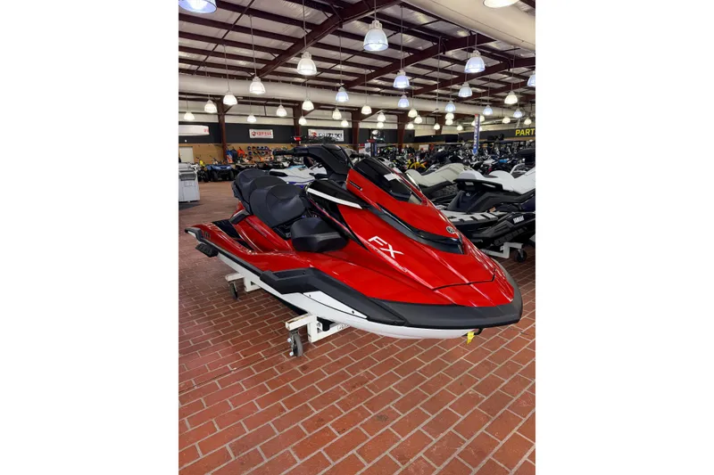The Image of 2026 Yamaha WaveRunner FX Cruiser HO in showroom, vibrant red color, sleek design. - 0