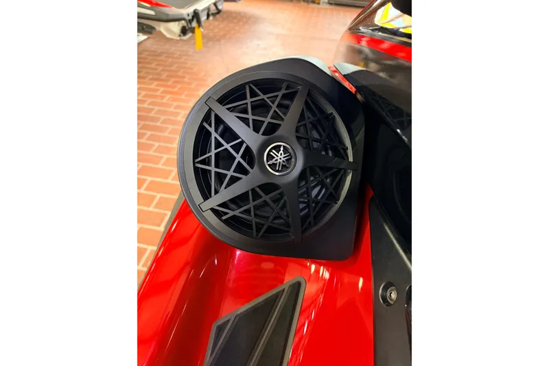 Slide: The Image of 2026 Yamaha WaveRunner FX Cruiser HO speaker detail on red body, showcasing sleek design. - 11