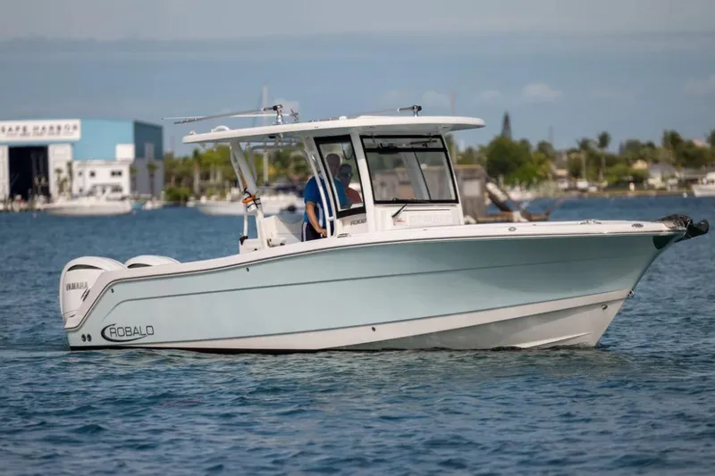 Slide: The Image of 2023 Robalo R302 Center Console boat cruising on calm waters. - 19