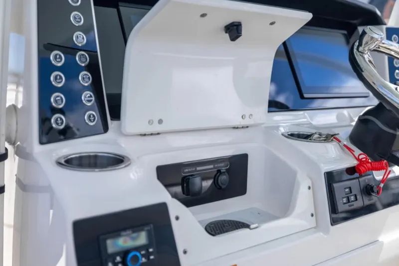 Slide: The Image of 2023 Robalo R302 Center Console dashboard with modern controls and sleek design. - 36