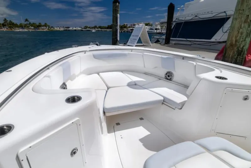 Slide: The Image of 2023 Robalo R302 Center Console boat interior with white seating and ocean view. - 47