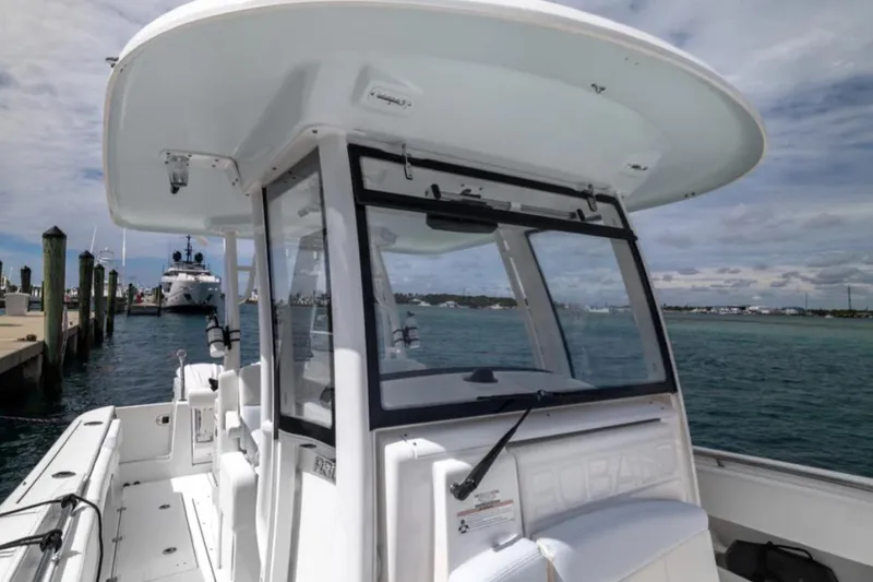 Slide: The Image of 2023 Robalo R302 Center Console boat docked by the marina. - 54