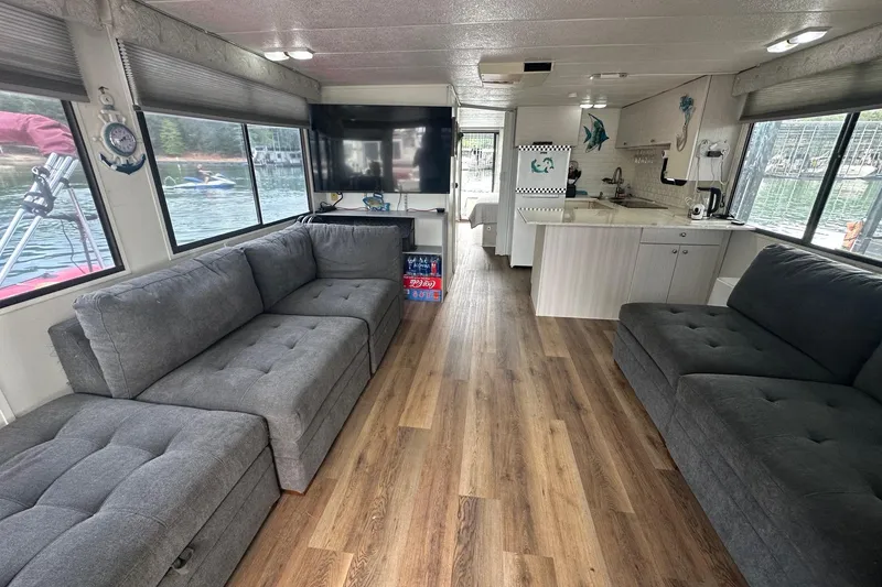 Slide: The Image of Interior of a 1996 Catamaran Cruisers 12x42 with modern furnishings and lake view. - 4