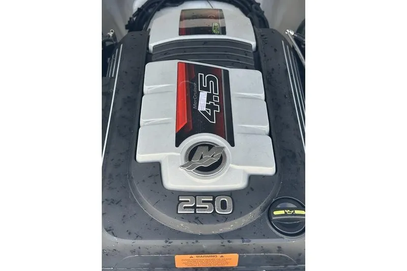 Slide: The Image of 2023 Chaparral 23 Surf boat engine, featuring a 4.5L 250 horsepower MerCruiser. - 12