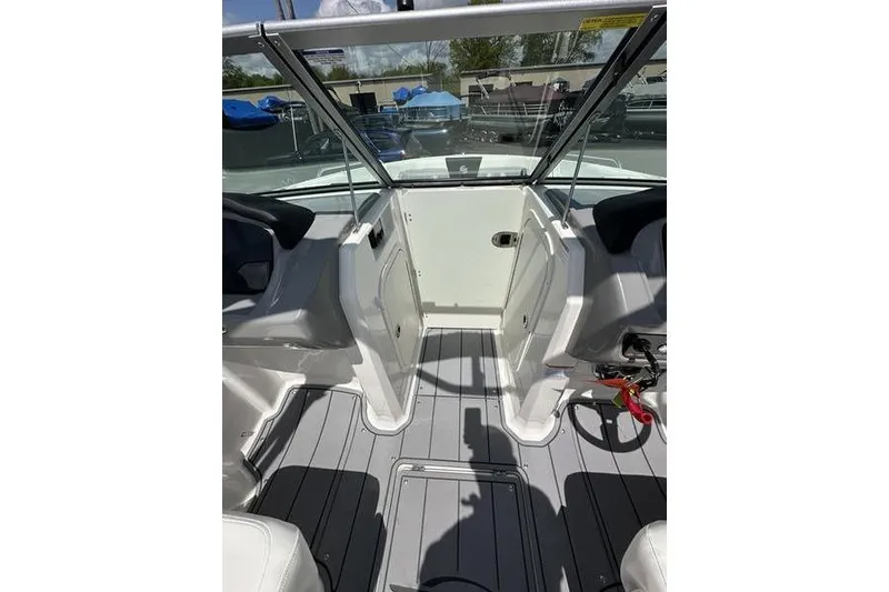 Slide: The Image of Interior view of 2023 Chaparral 23 Surf boat, featuring sleek seating and modern design. - 18