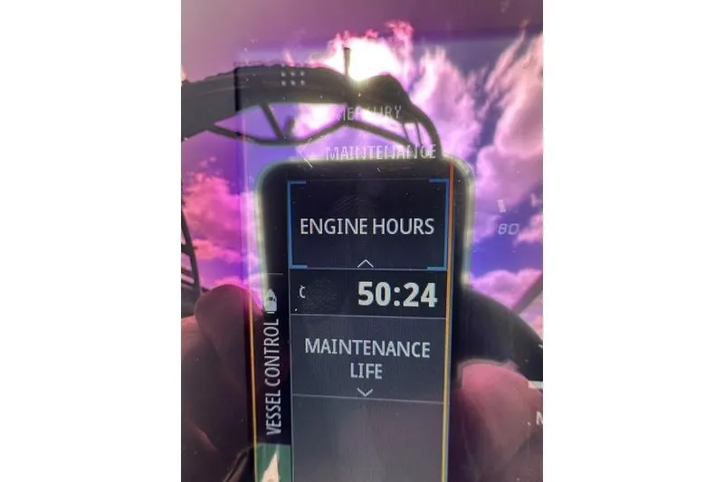 Slide: The Image of Display showing 50:24 engine hours on 2023 Chaparral 23 Surf boat. - 27