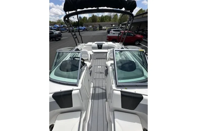 Slide: The Image of 2023 Chaparral 23 Surf boat interior with sleek seating and modern design. - 28