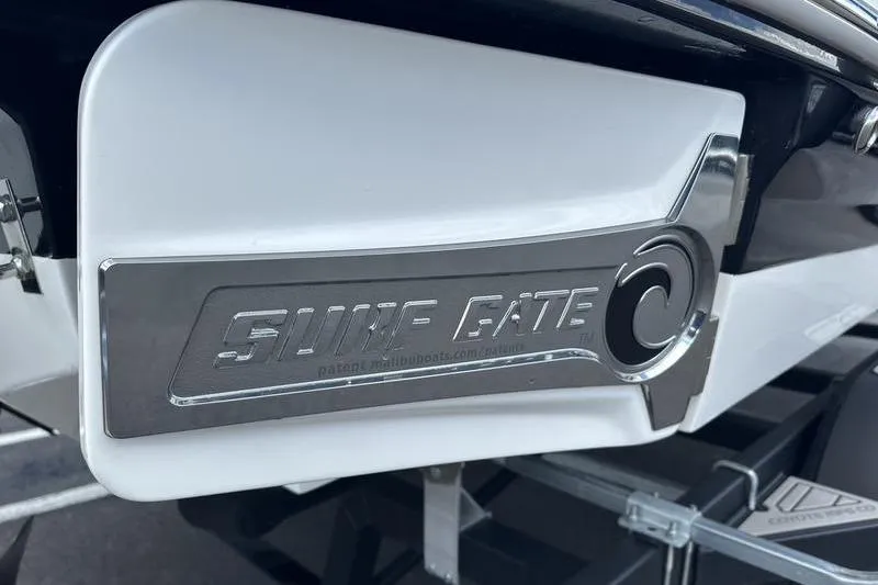 Slide: The Image of 2023 Chaparral 23 Surf boat featuring a sleek Surf Gate design. - 35