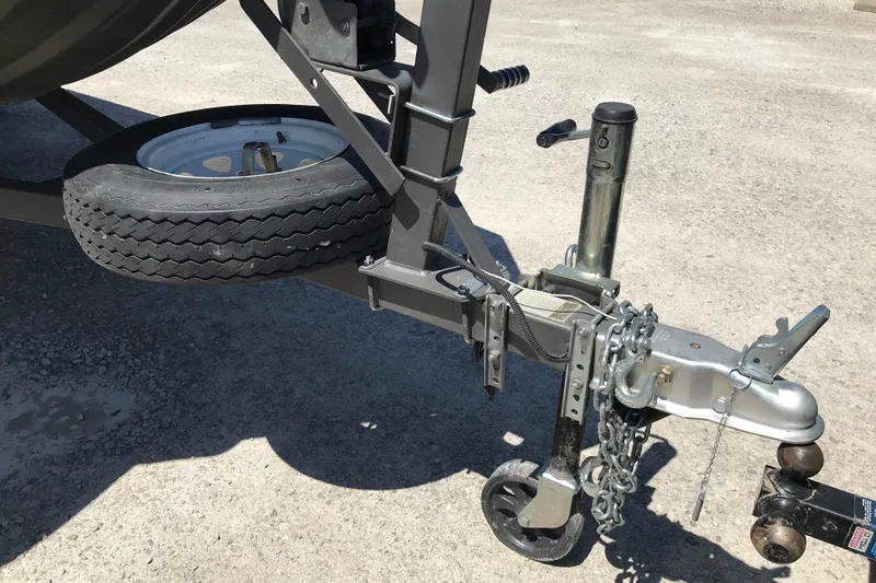 Slide: The Image of Trailer hitch and spare tire of a 1992 Alweld 1856VV Large Vee Bottom boat. - 15
