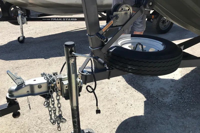 Slide: The Image of Trailer hitch and spare tire of a 1992 Alweld 1856VV Large Vee Bottom boat. - 16